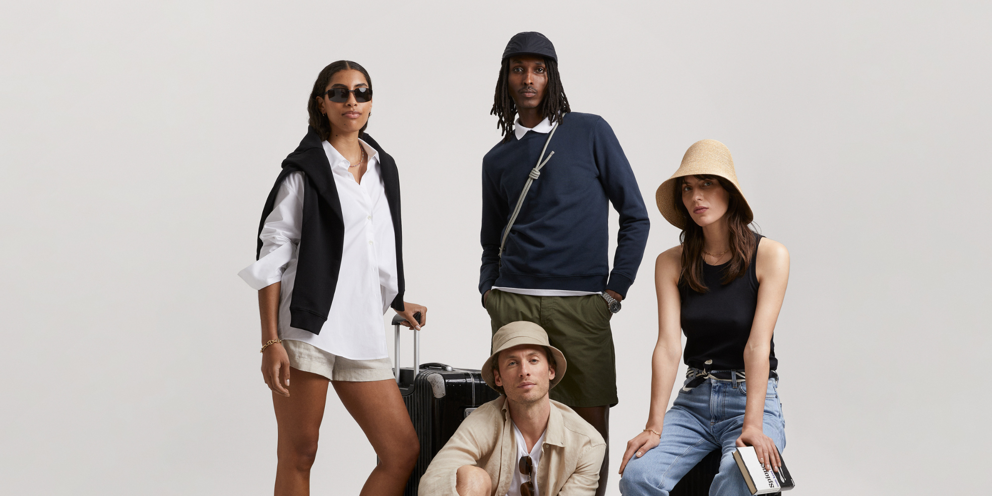 People wearing tops, sweaters, jackets, bottoms and accessories by Asket.