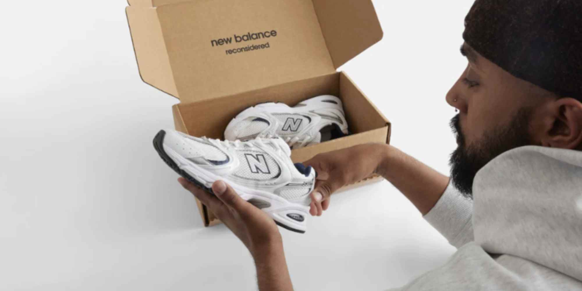 person looking at pre owned trainers from new balance reconsidered