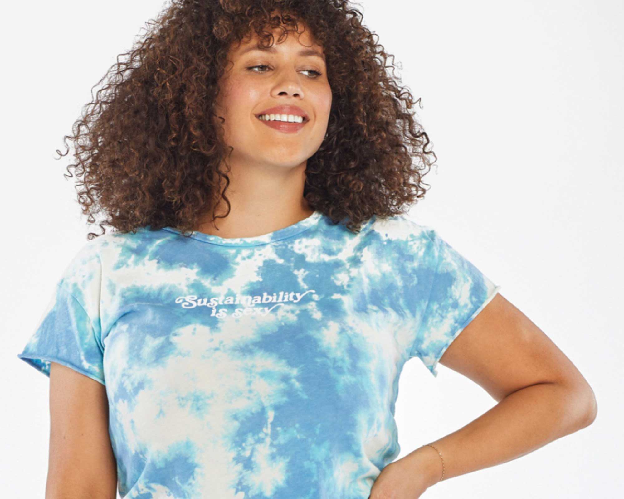 woman wearing blue sustainable slogan tshirt