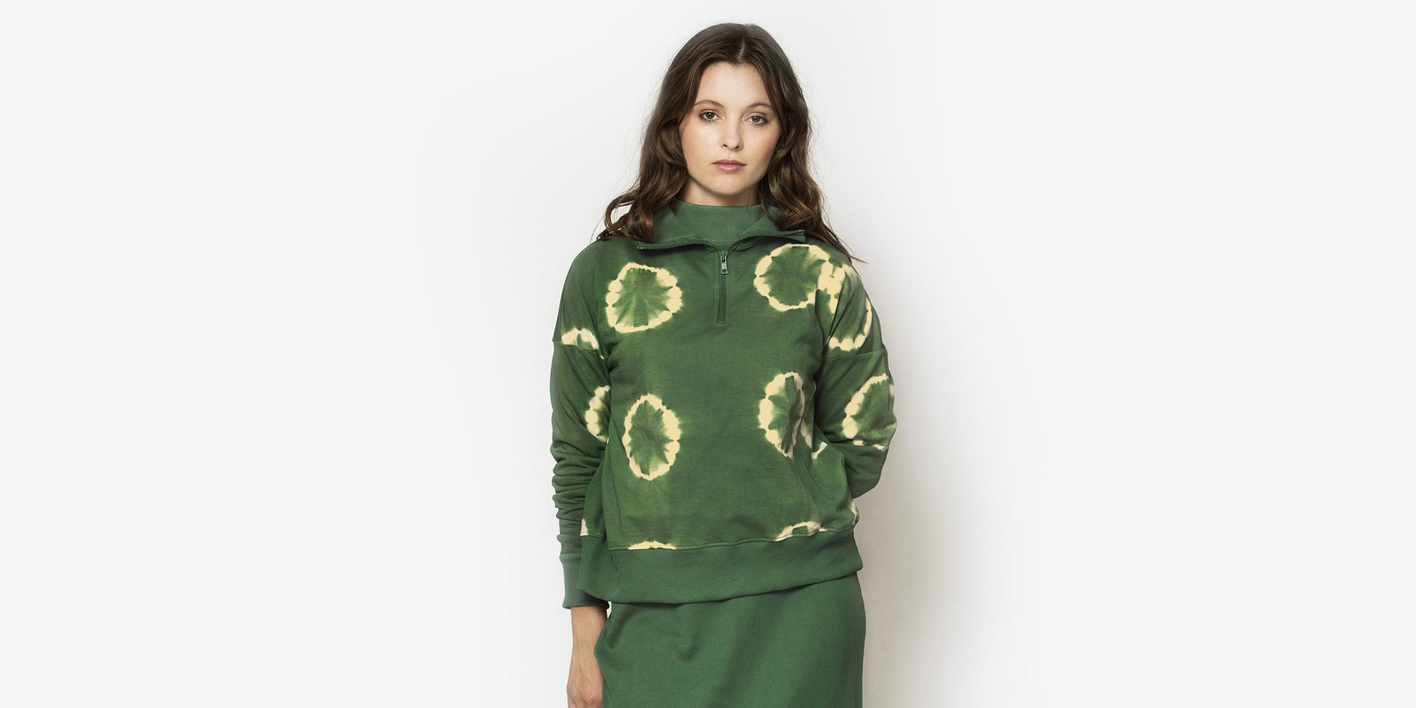 woman wearing green nico sweatshirt