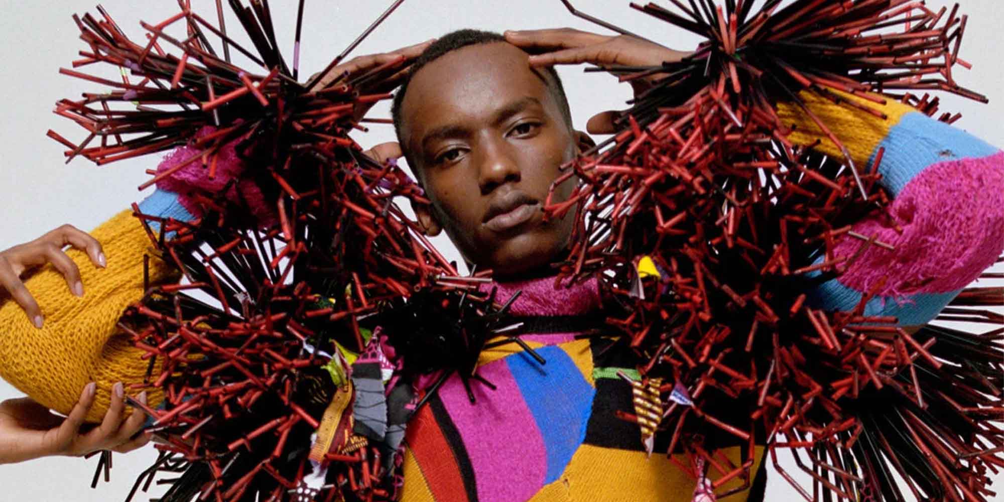 man in multicoloured jumper from sustainable online fashion course about the business of fashion