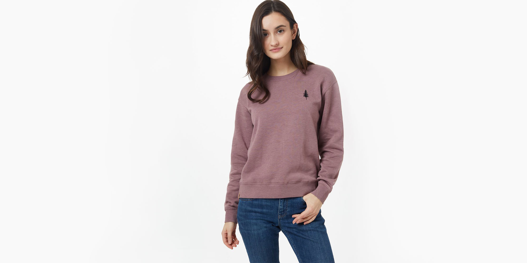 woman wearing dusty pink sweatshirt by tentree