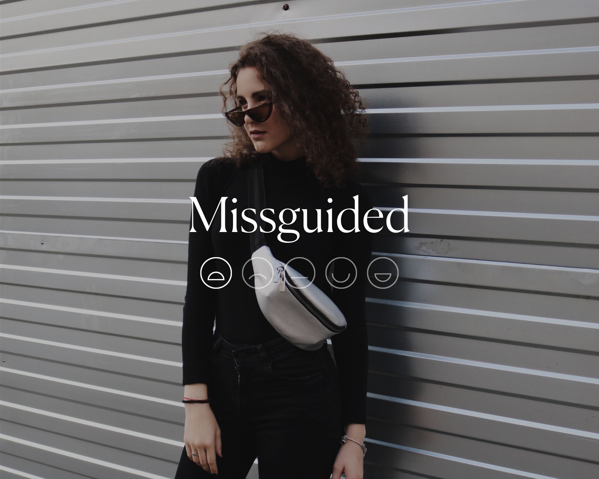 Someone wearing a black top and white fanny pack with the word Missguided and a sad face highlighted.