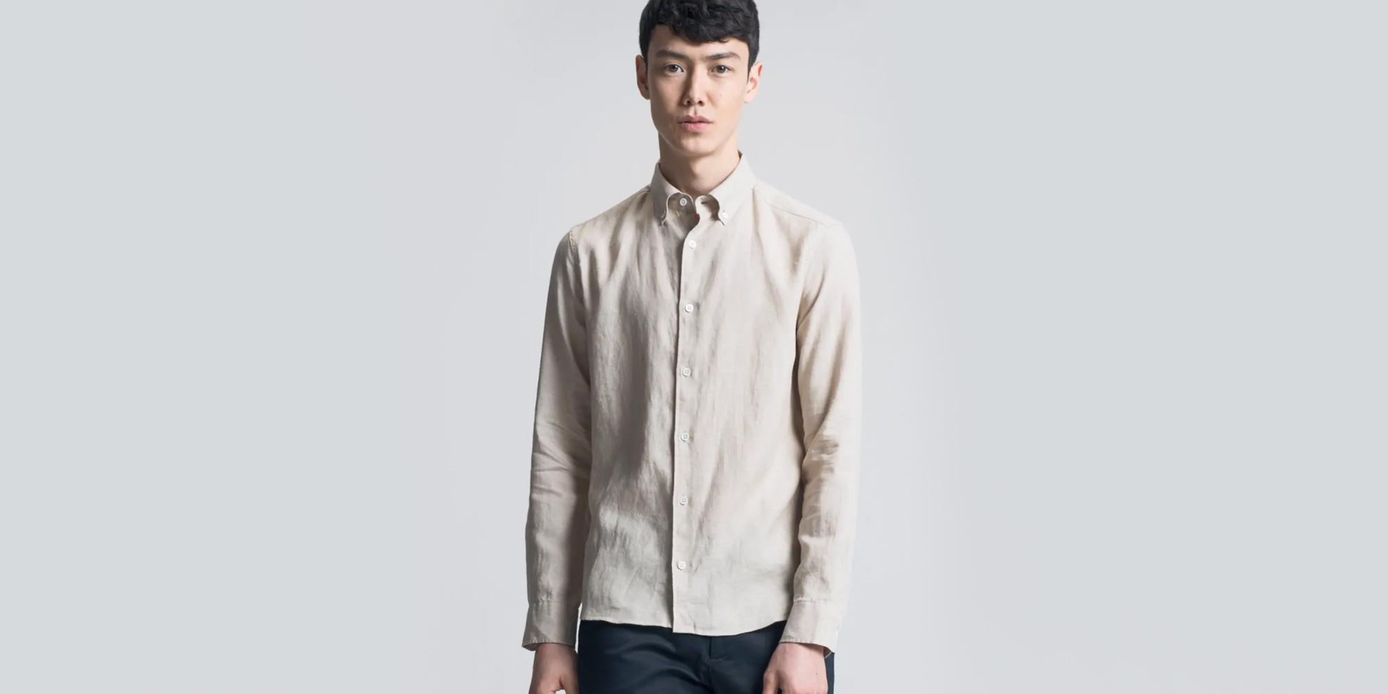 man wearing beige linen shirt by asket