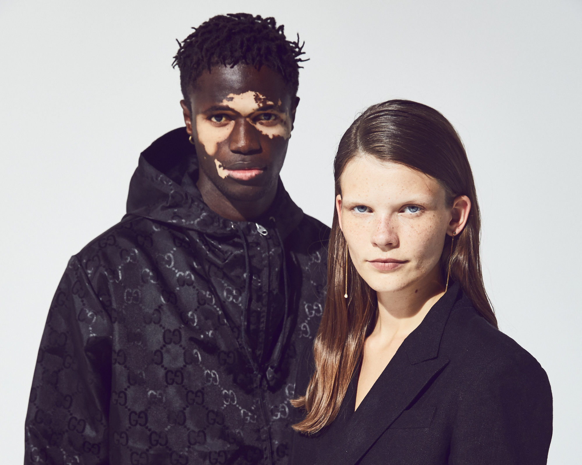 man and woman wearing sustainably made luxury fashion from LuisaViaRoma