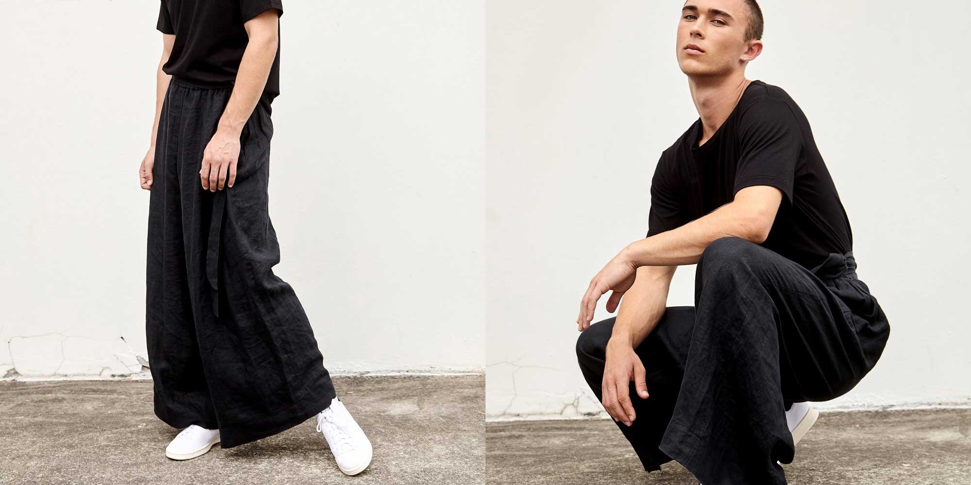 man wearing black linen trousers by abch