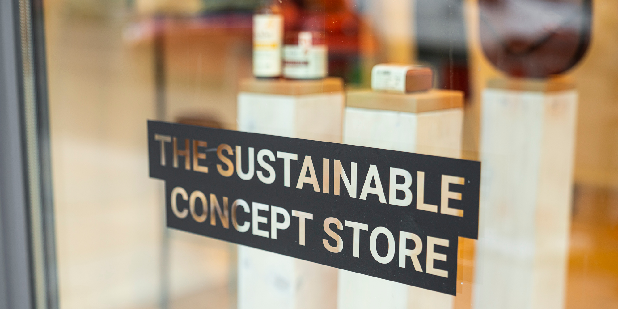 Staiy concept store window with sticker that says
