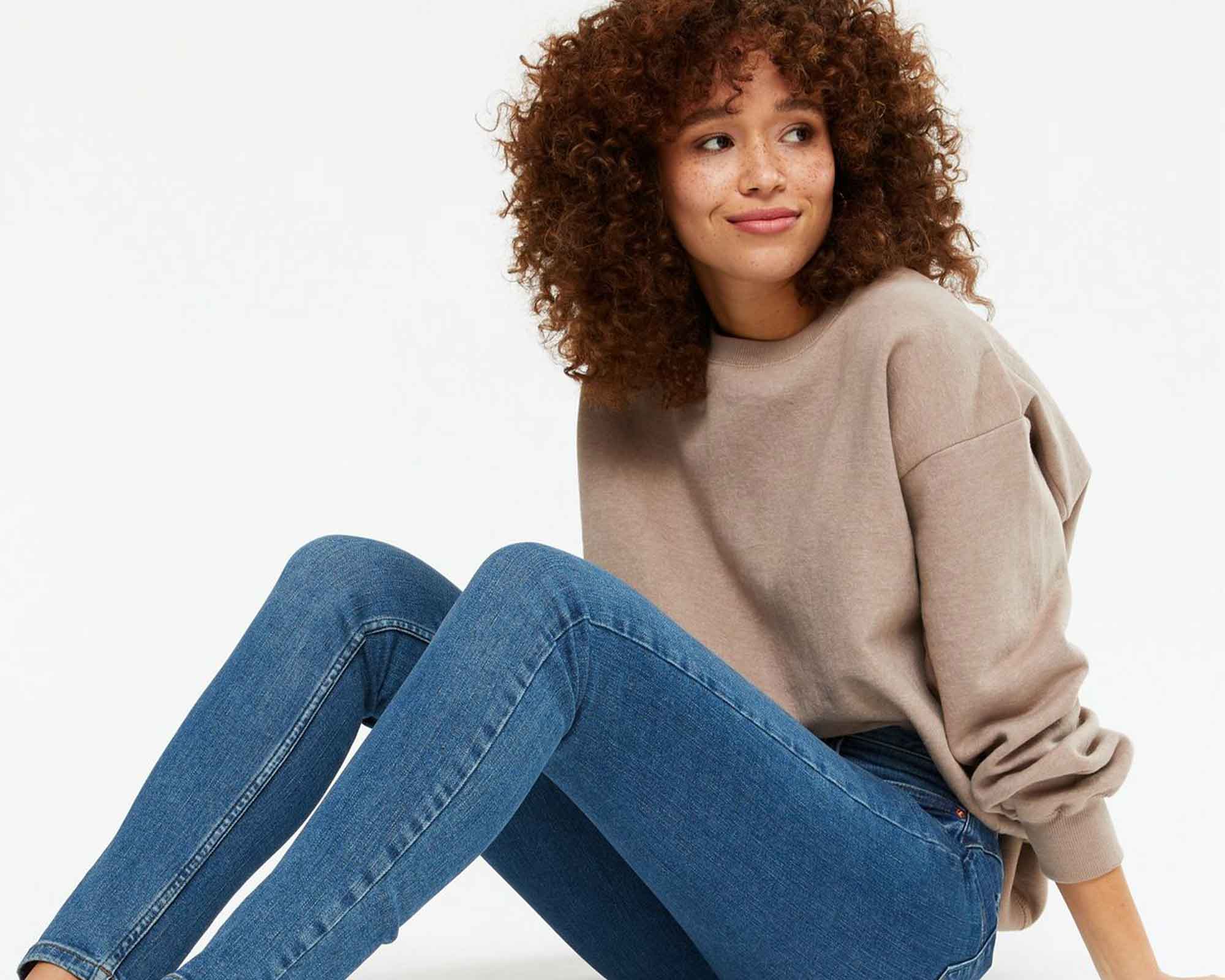 woman wearing brown sweatshirt by newlook