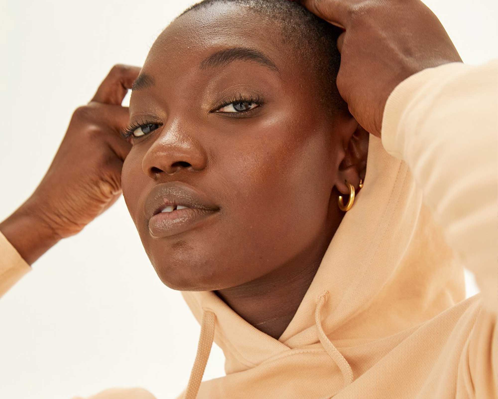woman wearing beige hoodie