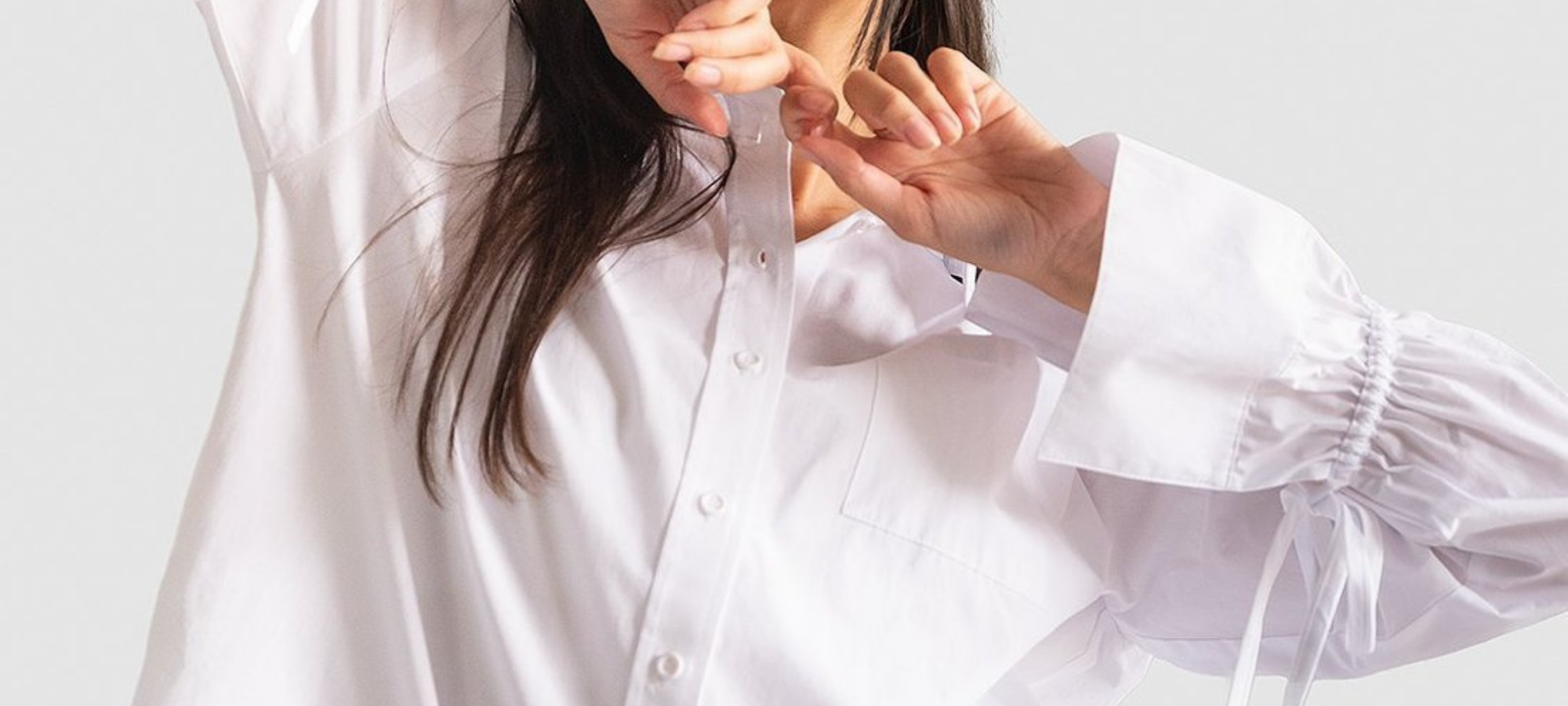 close up of woman wearing white eco-friendly blouse from nu-in brand