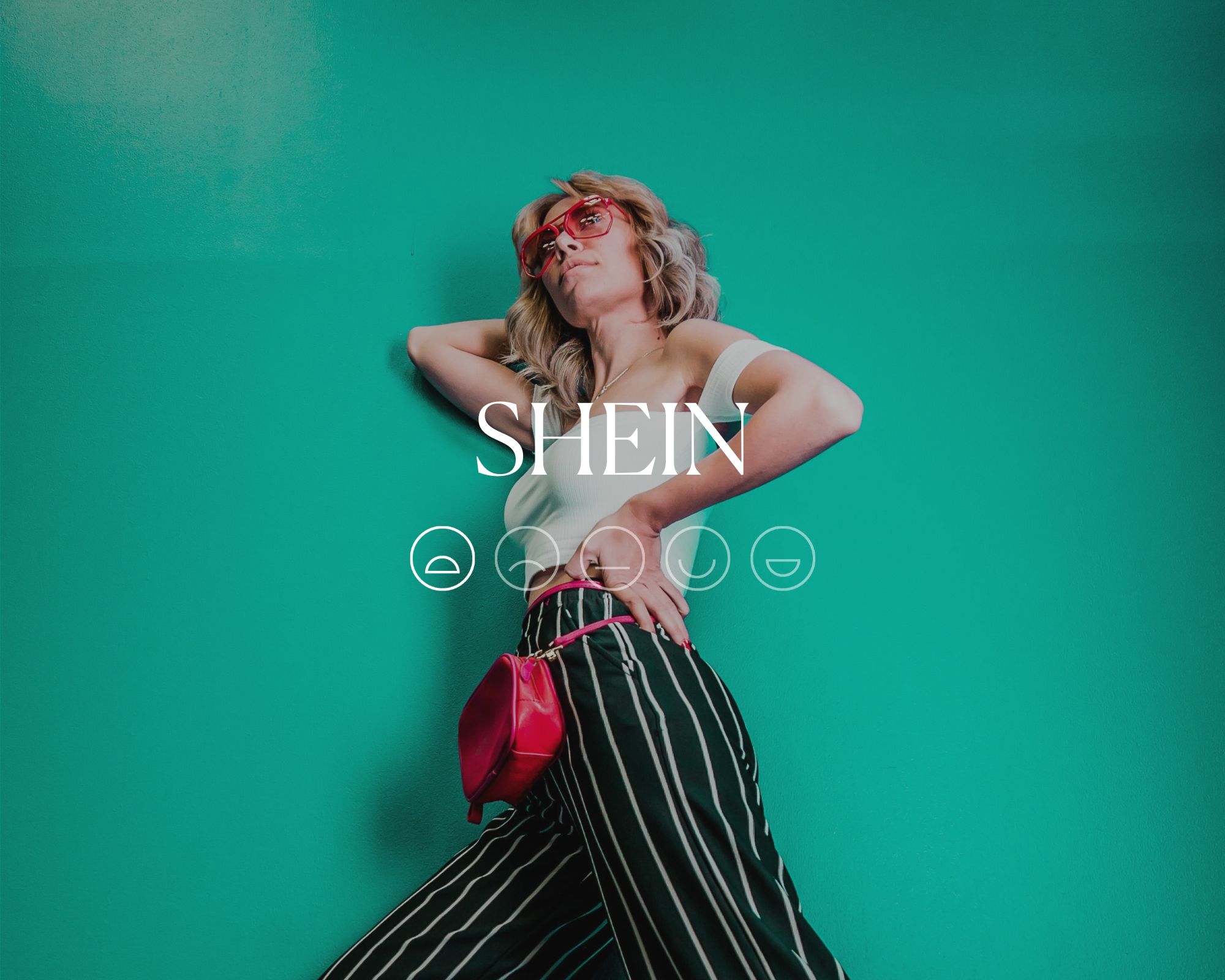 Someone wearing a white top and striped black and white pants with a red handbag, overlaid with white font reading SHEIN with a sad emoji highlighted.