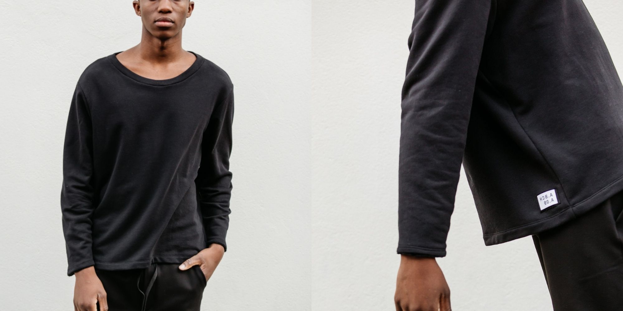 man of colour wearing black eco-friendly sweater by A.BCH brand