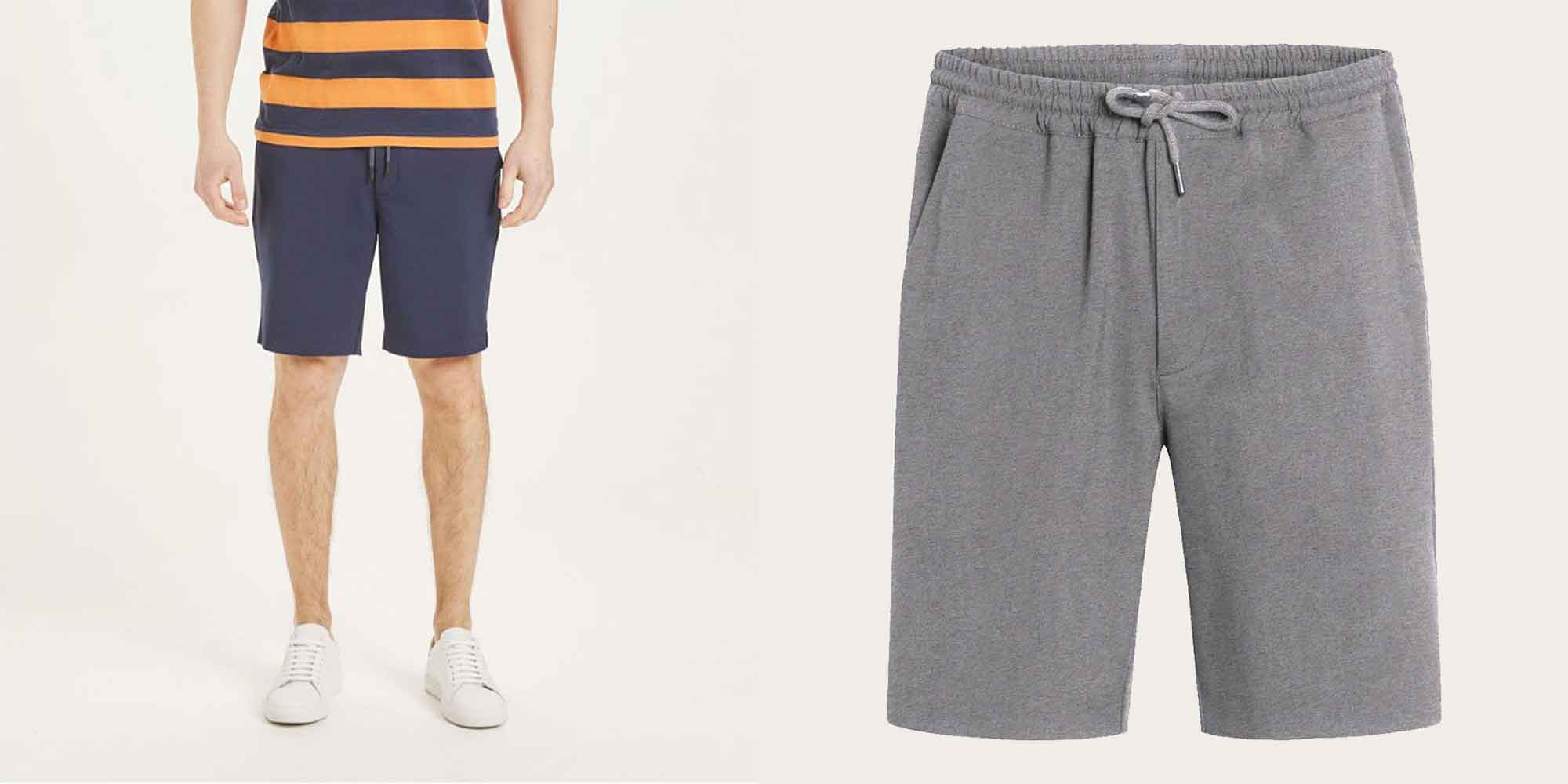 man wearing blue sports shorts by knowledge cotton apparel