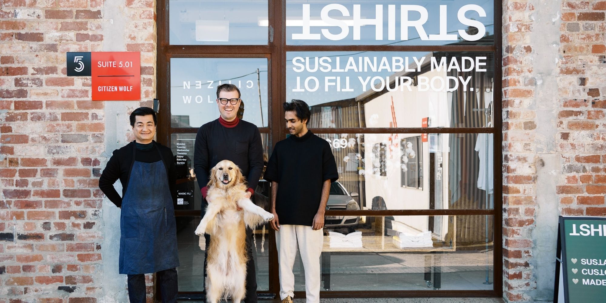 Citizen Wolf founders and their golden retriever outside Sydney store