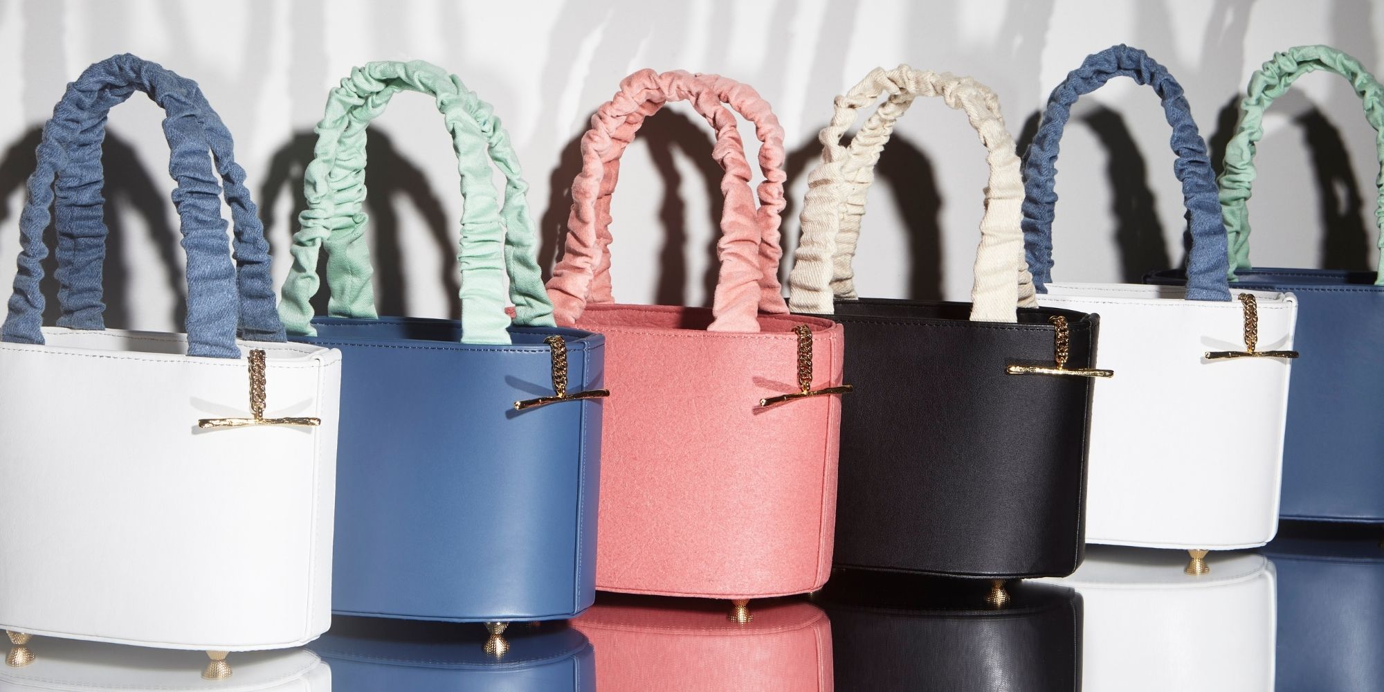 row of colourful sustainable handbags designed by Mashu