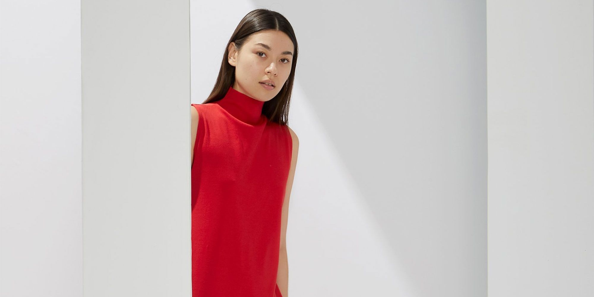Asian woman wearing red sleeveless skivvy dress by A.BCH