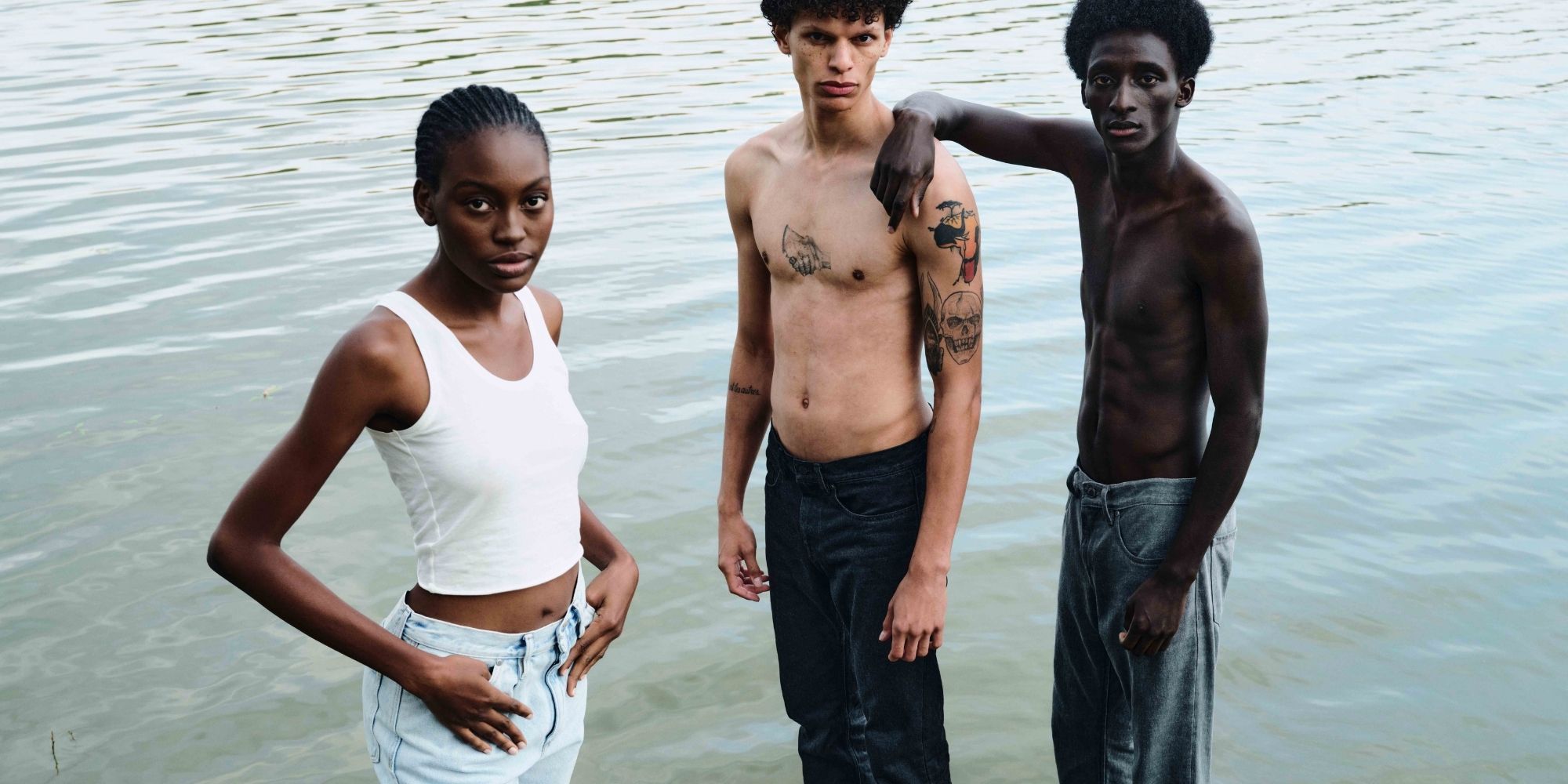 three people in water wearing ethical jeans by Armedangels