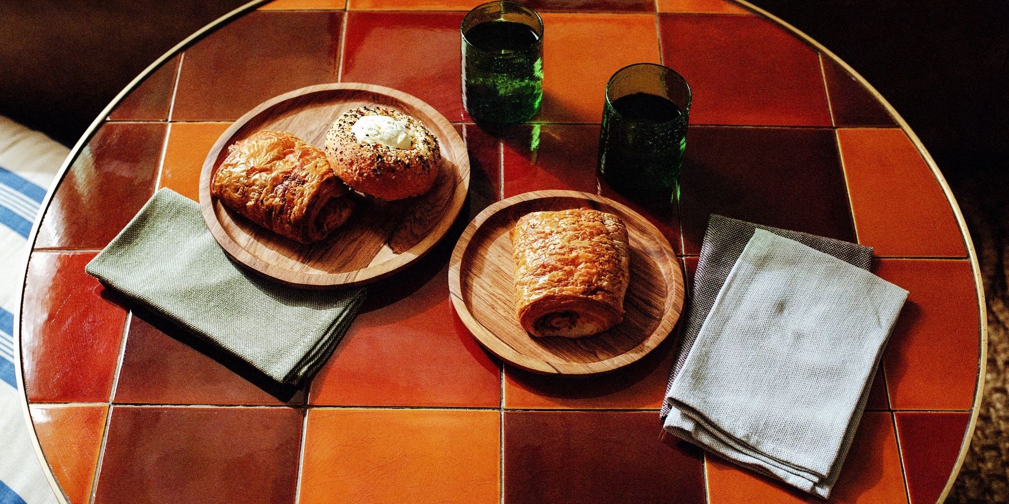 raven + lily ethically made hand towels on orange checkered table
