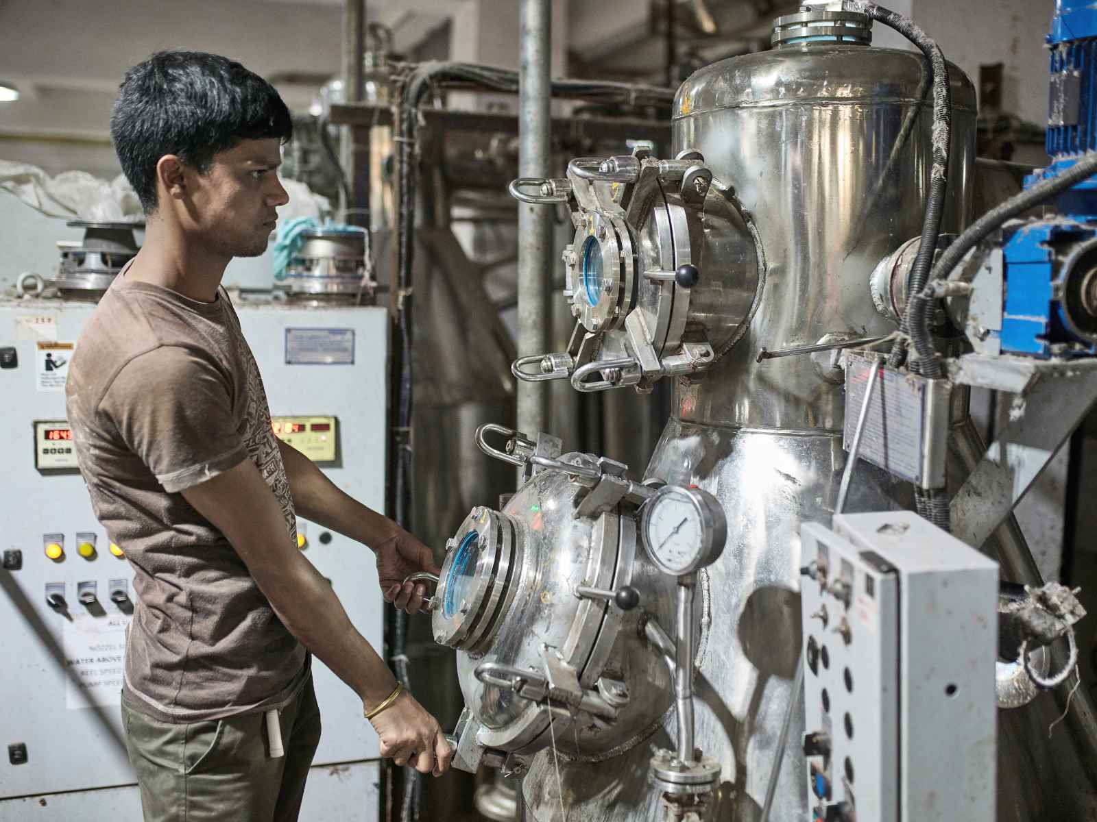 Person operating textile dyeing machine