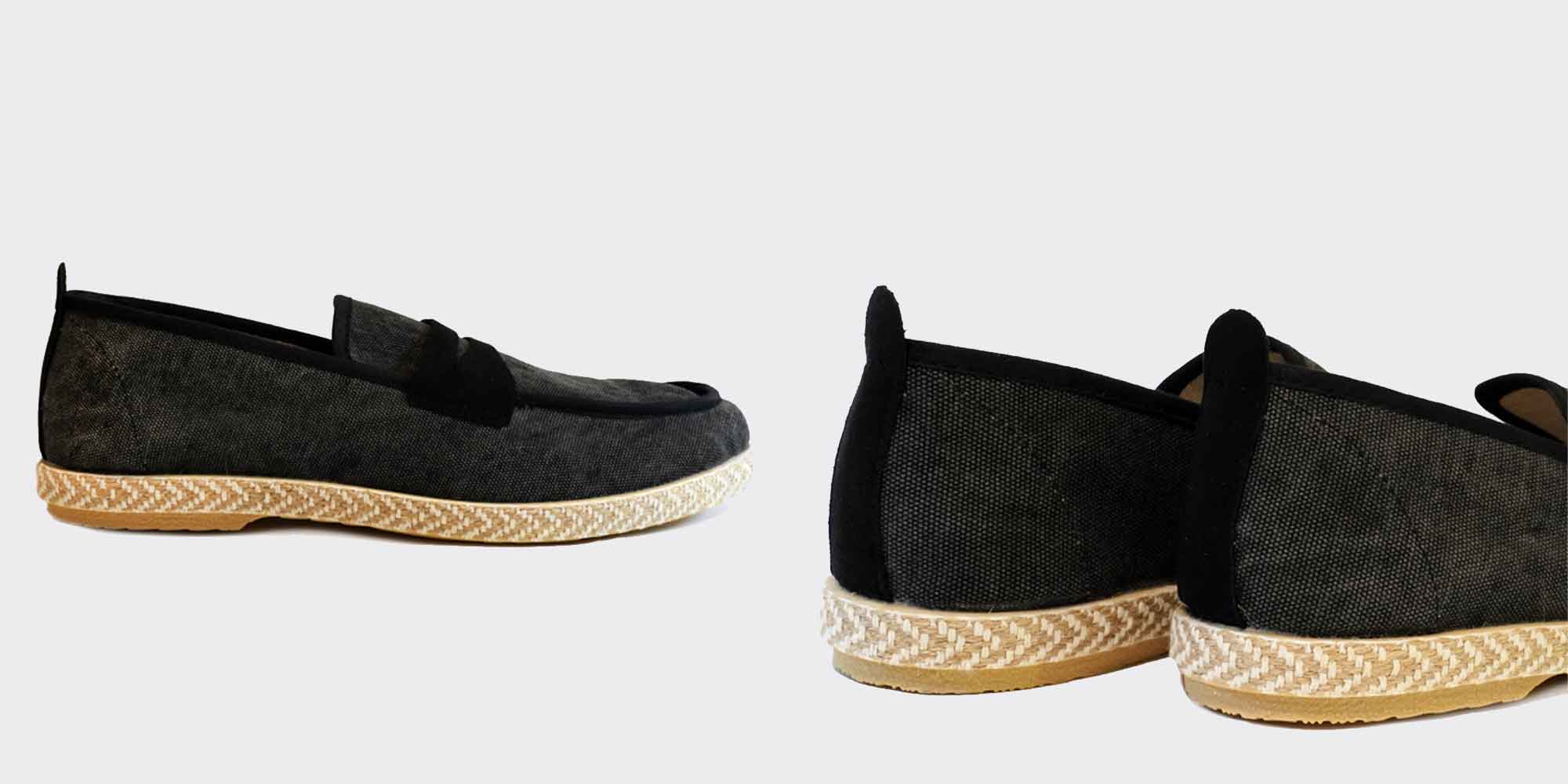 Close up of black sustainable slippers with beige sole made ethically by NOAH.