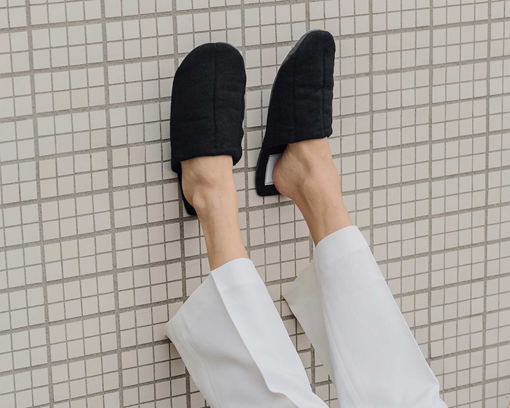 Close up of black hemp sustainable slippers by Saana ja Olli.