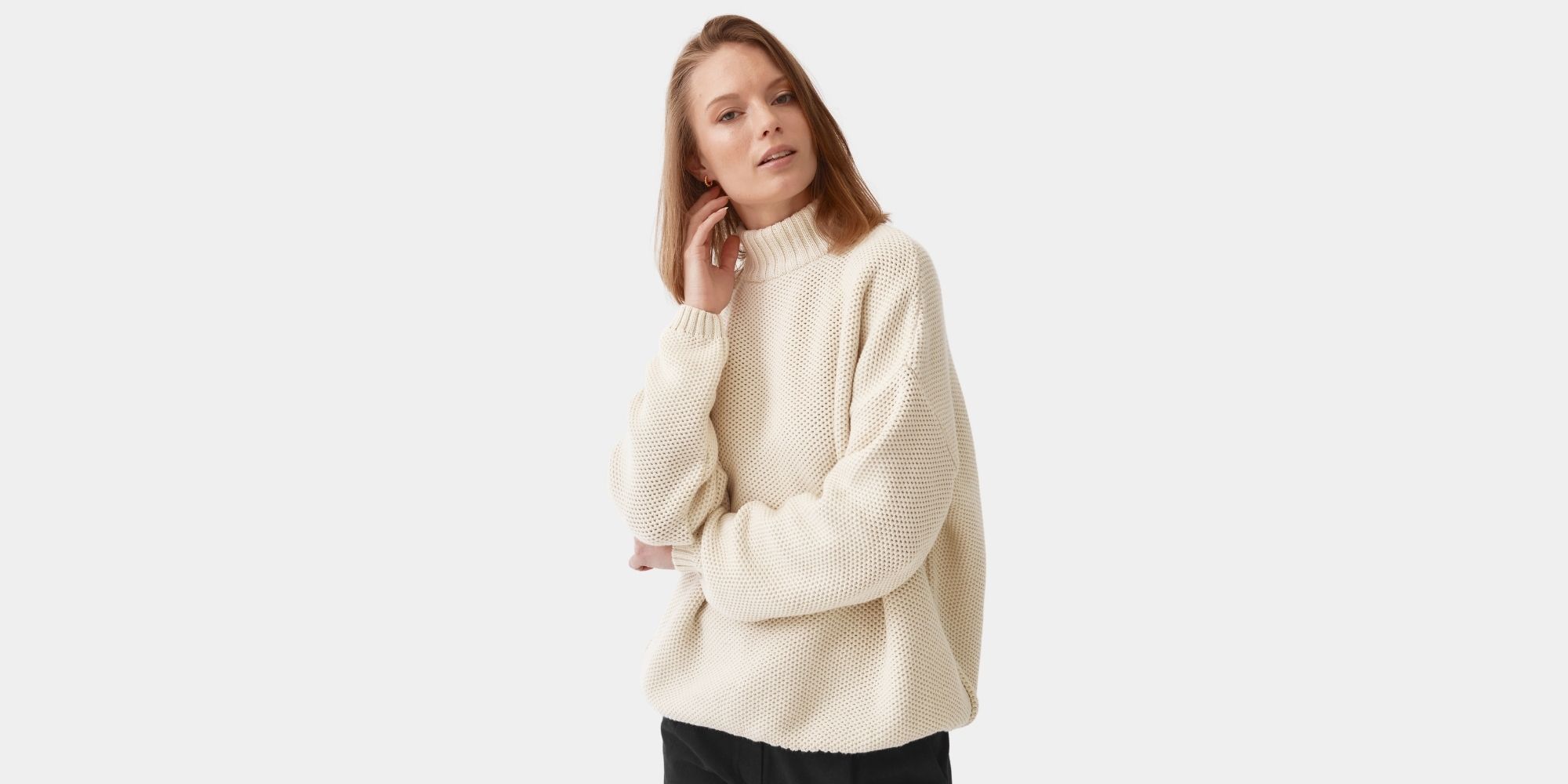 woman wearing sustainable cream knitted sweater by Mila.Vert
