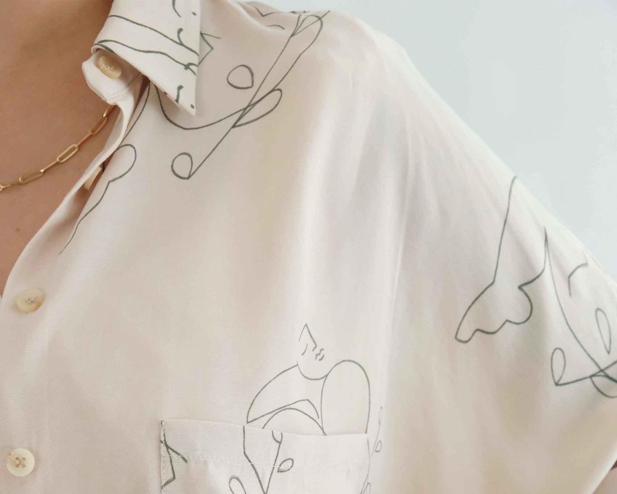 Close up of cream handprinted vegan silk shirt by OhSevenDays.