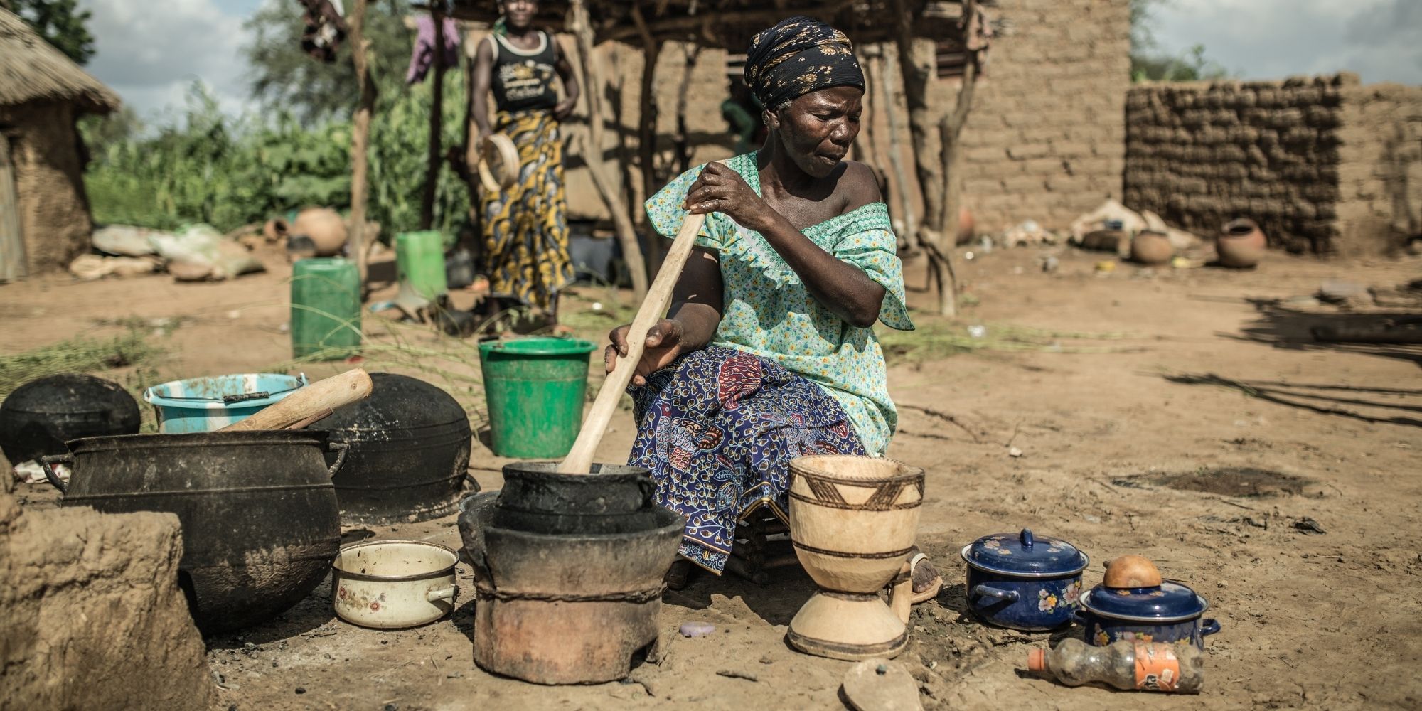 Person gathering water through the help of LVRSustainable and Oxfam Italia initiative.
