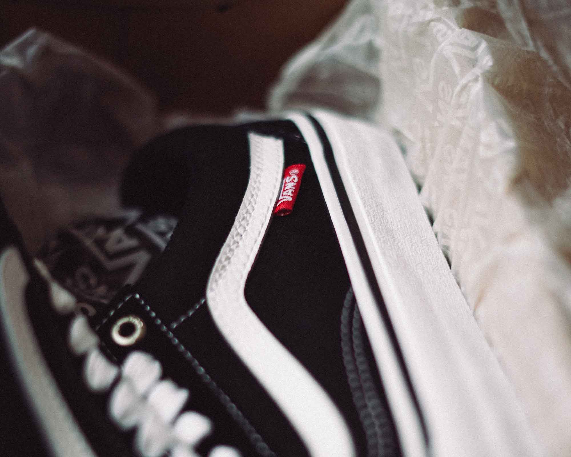 Close up of a black and white Vans sneaker.
