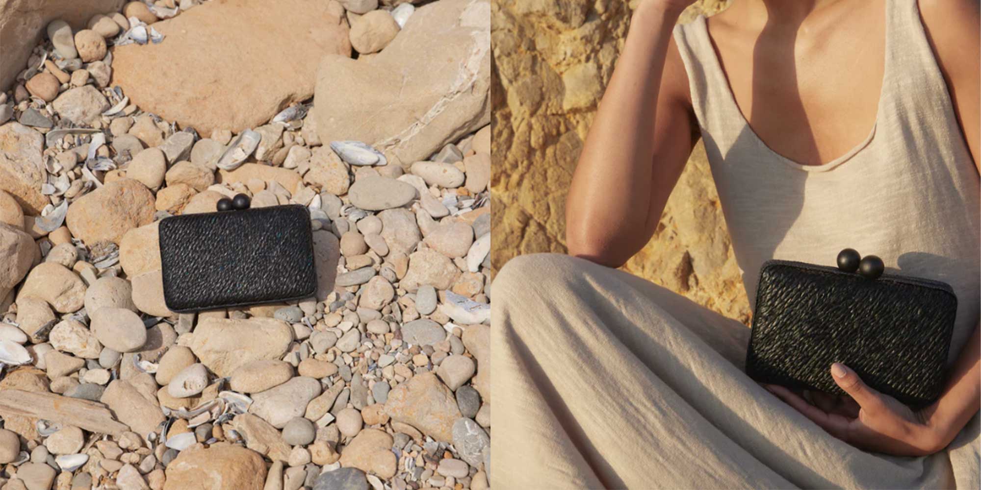 A black sustainable straw and wooden ball clasps clutch from KAYU.