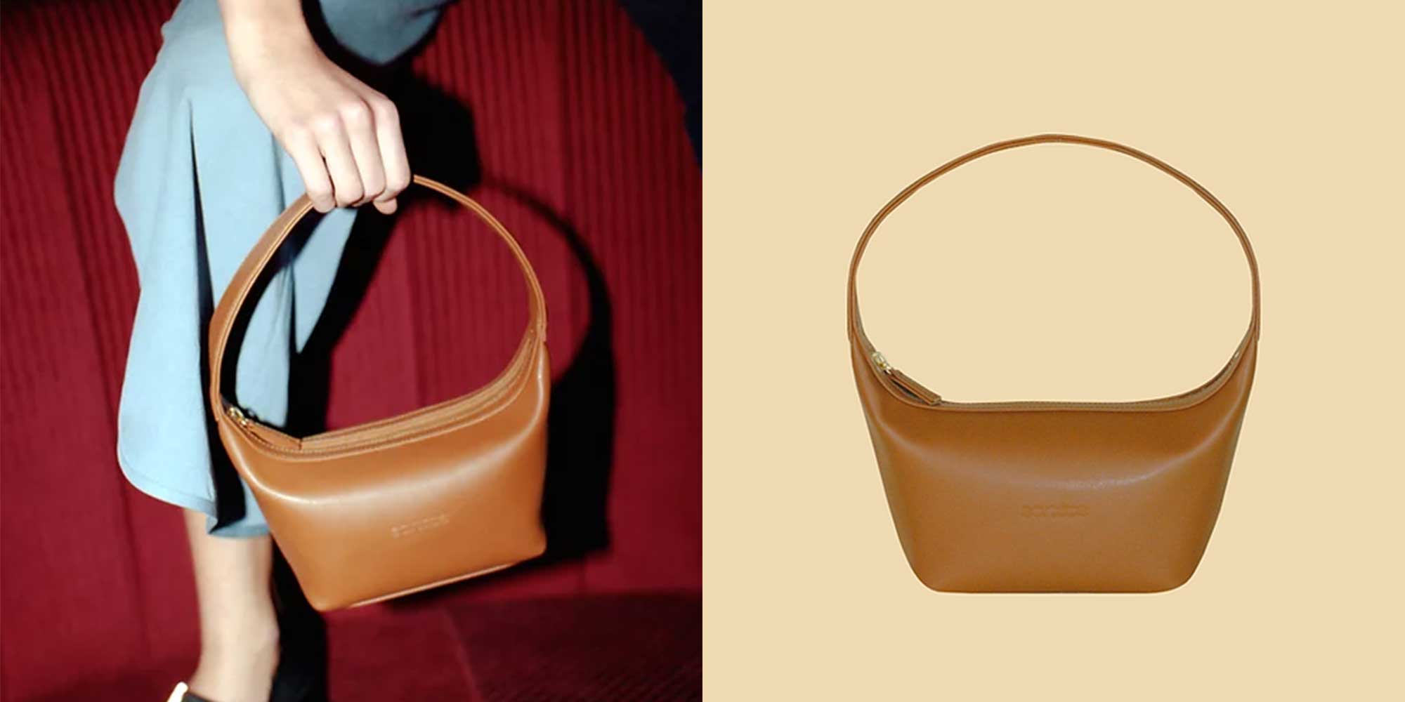 A tan handmade vegan cactus leather handbag with wide round handles.