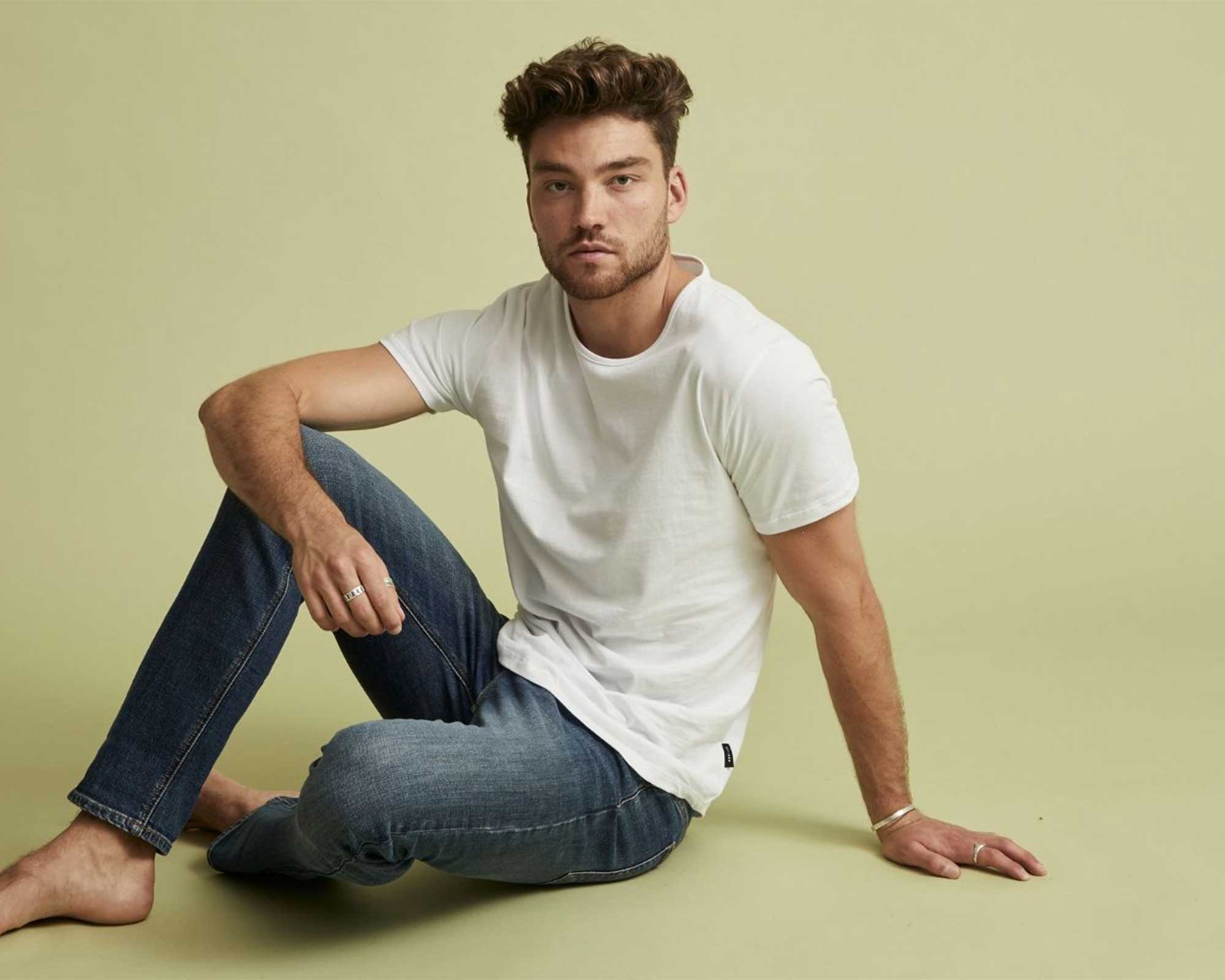 Someone wearing a white custom t-shirt by Citizen Wolf.