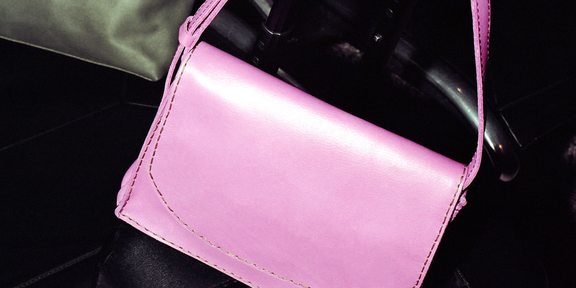 A small pink leather handbag by Raven + Lily.