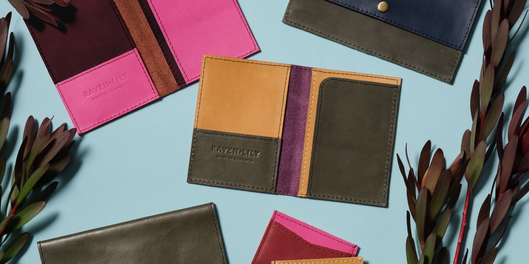 A selection of colourful leather passport holders by Raven + Lily.