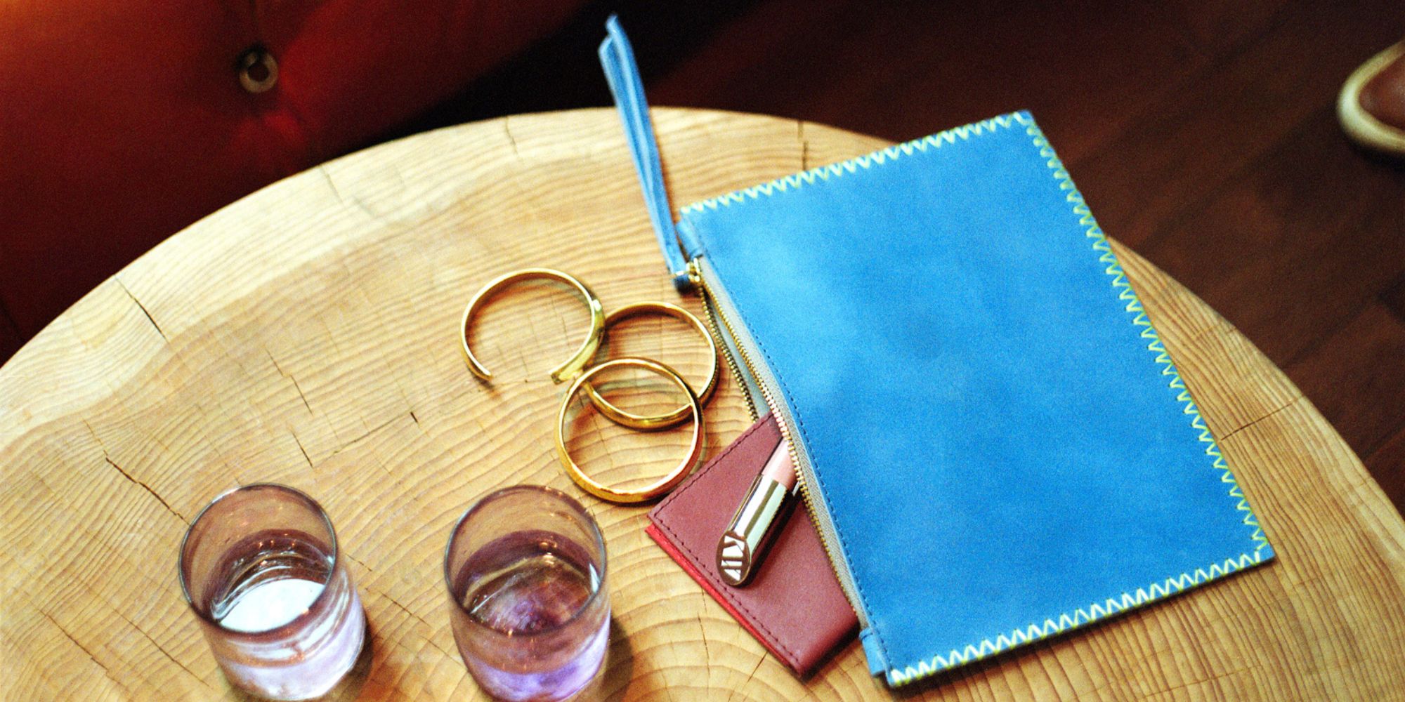 A blue leather pouch consciously made by Raven + Lily.
