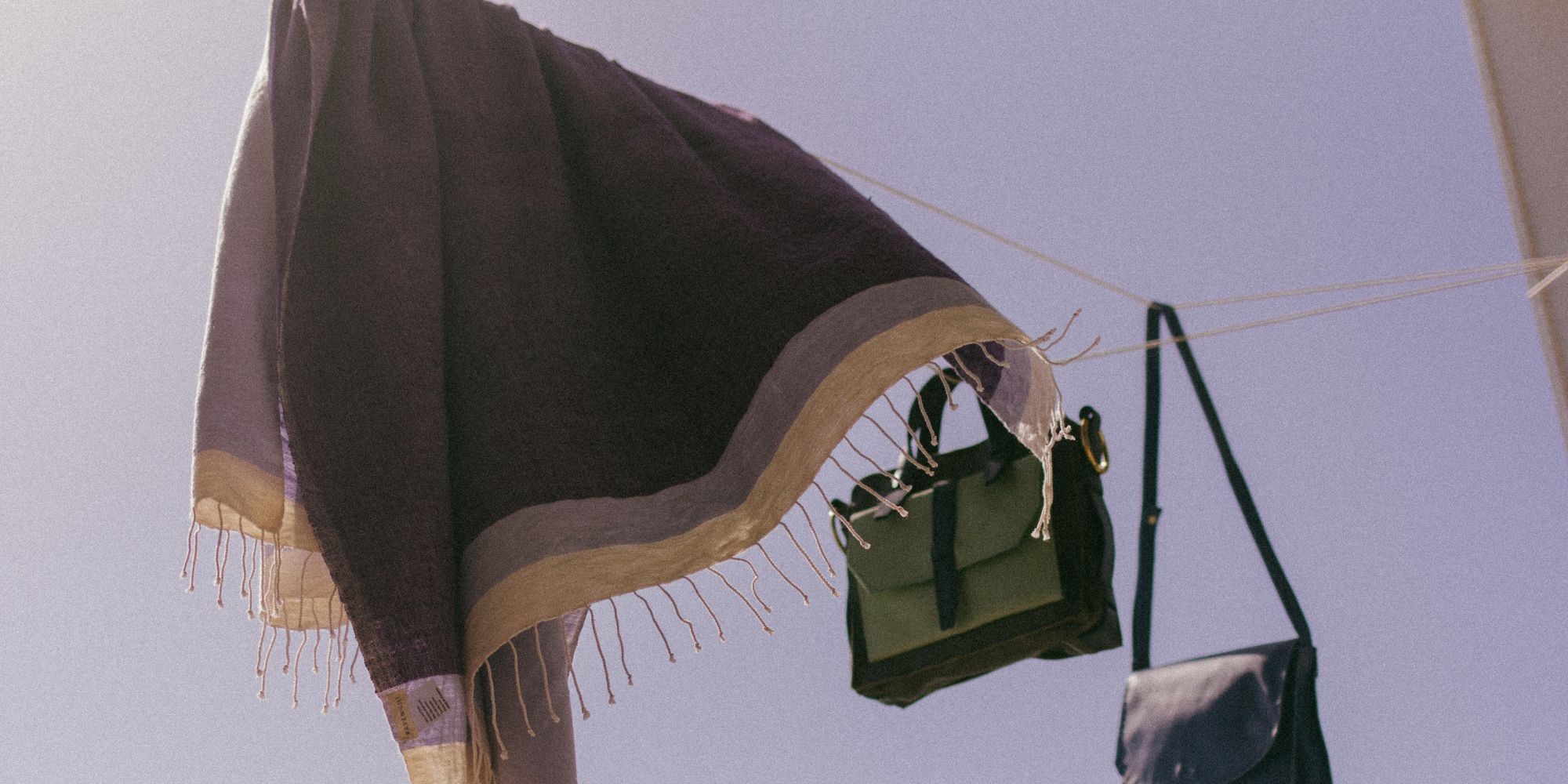 A purple cotton towel made sustainably by Raven + Lily.