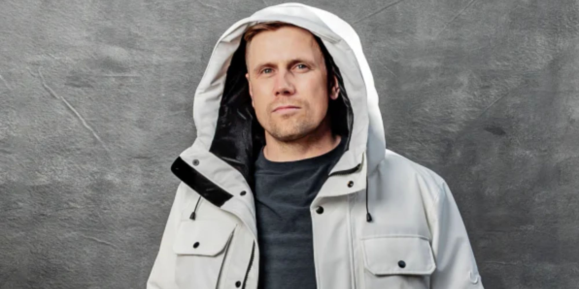 Wuxly founder James Yurichuk wearing a white vegan Canadian puffer jacket.