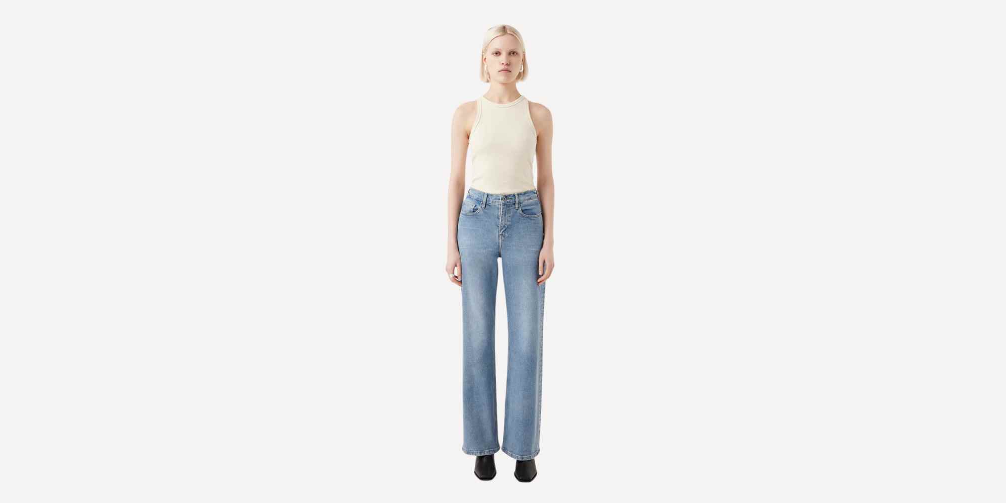 persona wearing blue jeans from outland denim