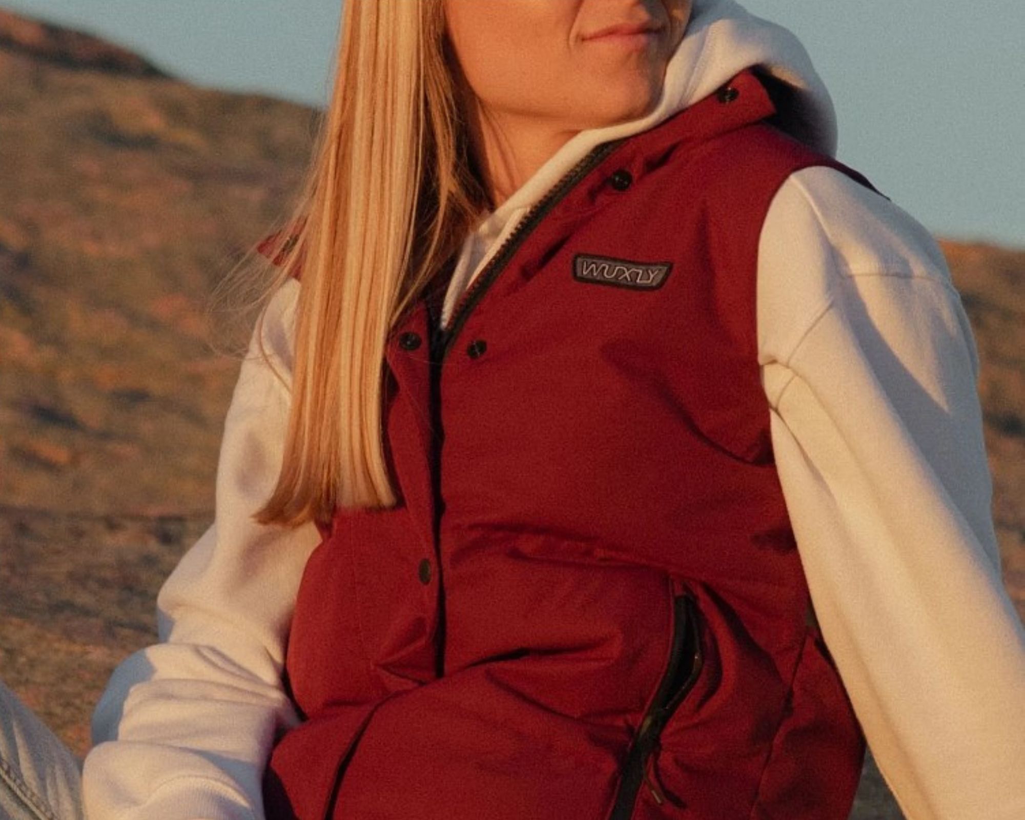 A red responsibly made puffer vest by Wuxly.