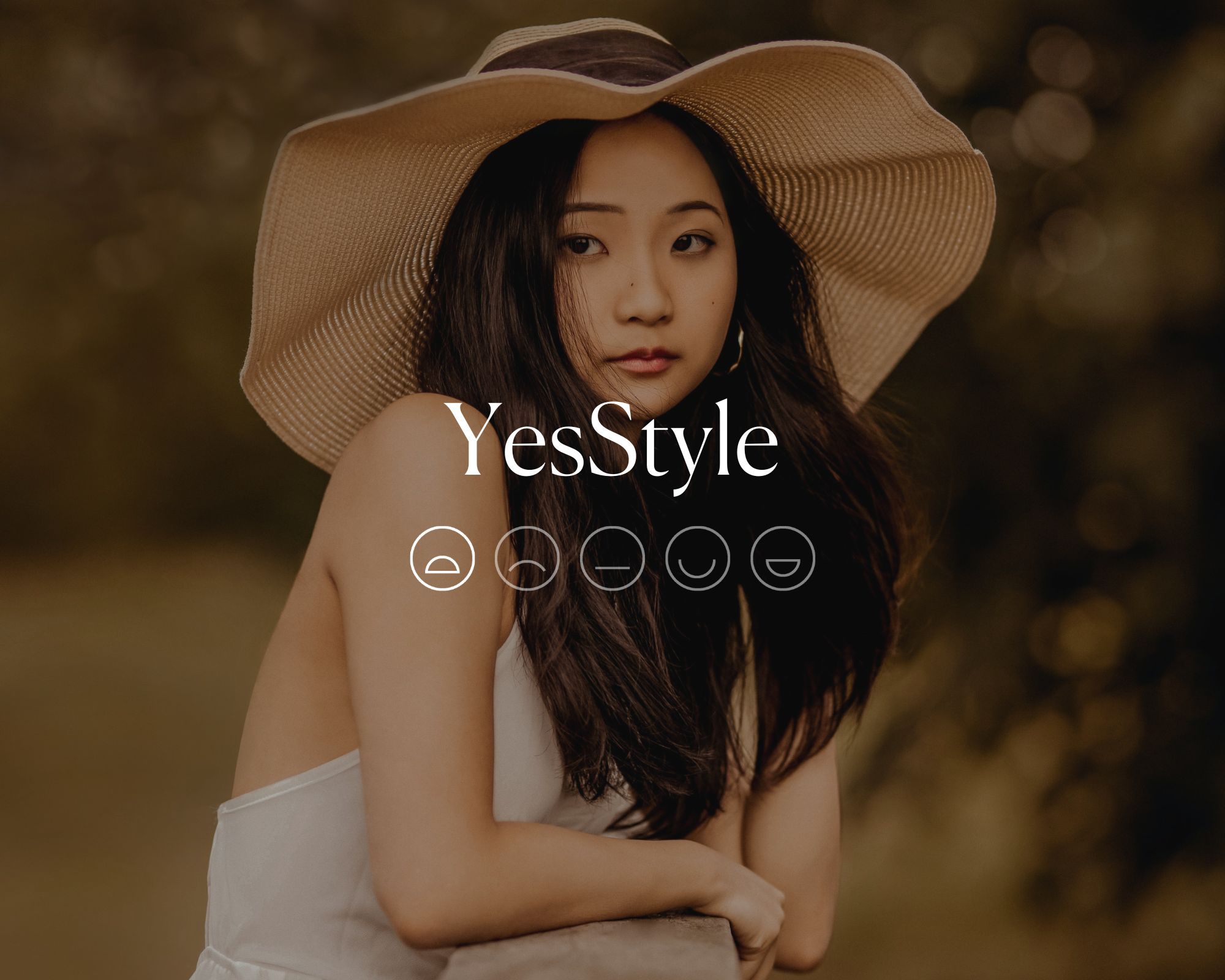 Someone wearing a floppy hat and white dress with YesStyle written over the top above a sad smiley face emoji.