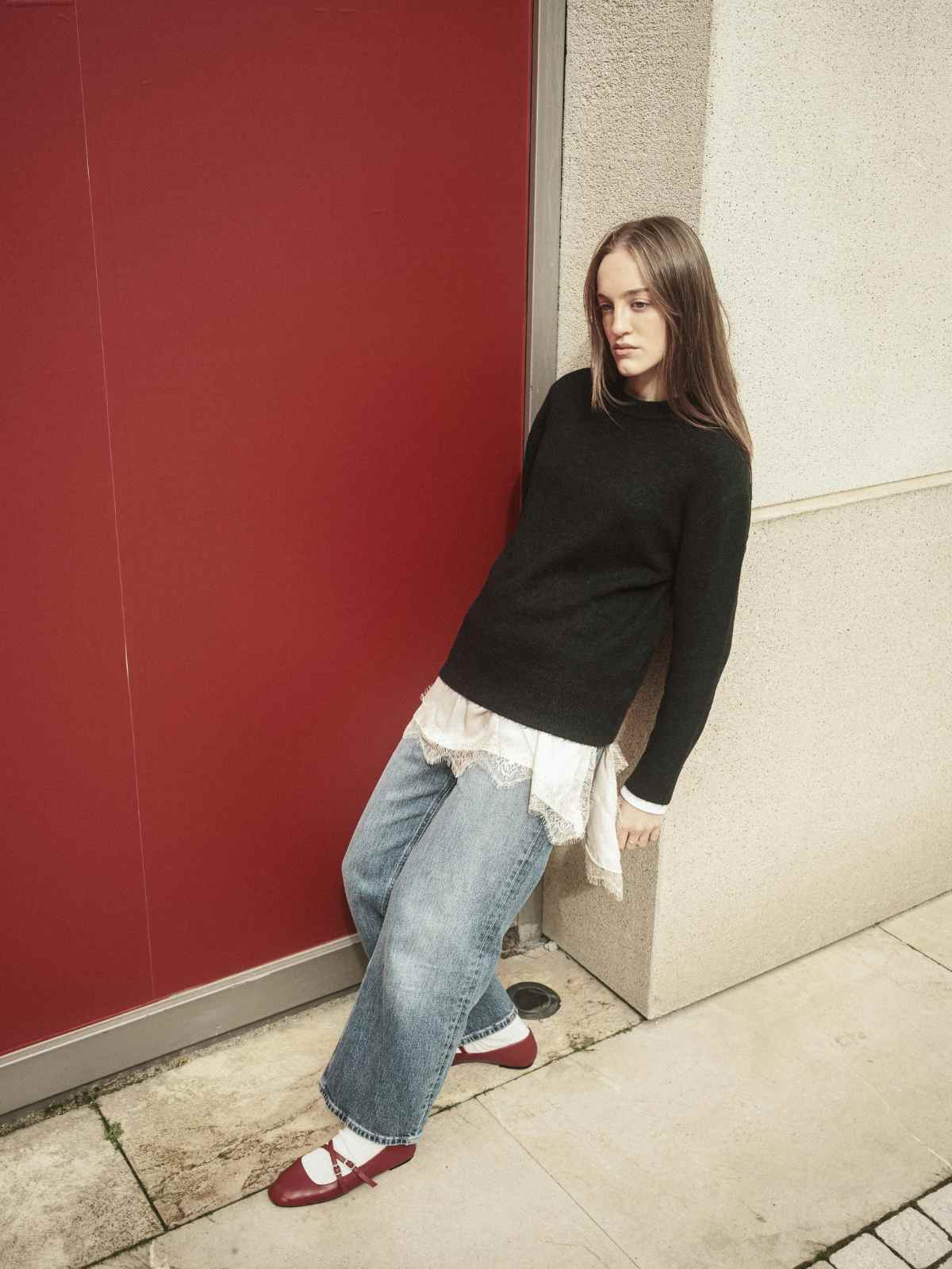 person wearing black sweater and jeans