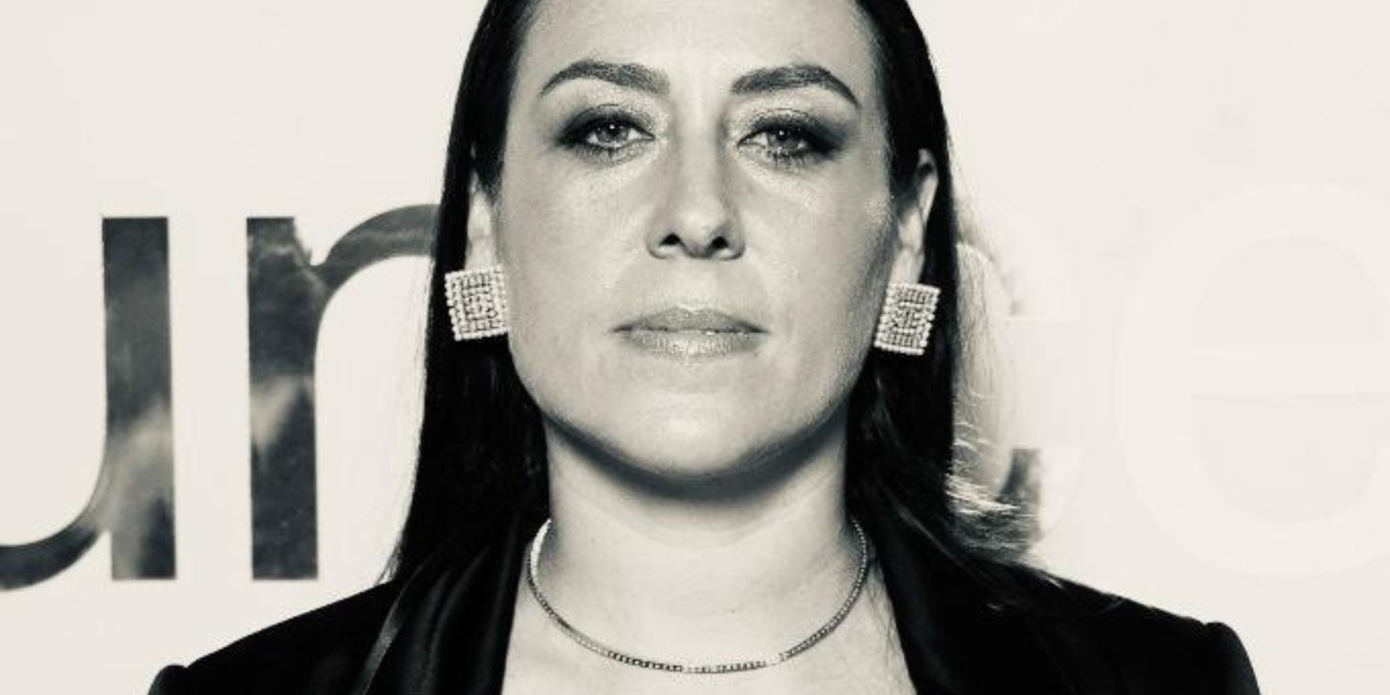 A black and white portrait of Luisa
