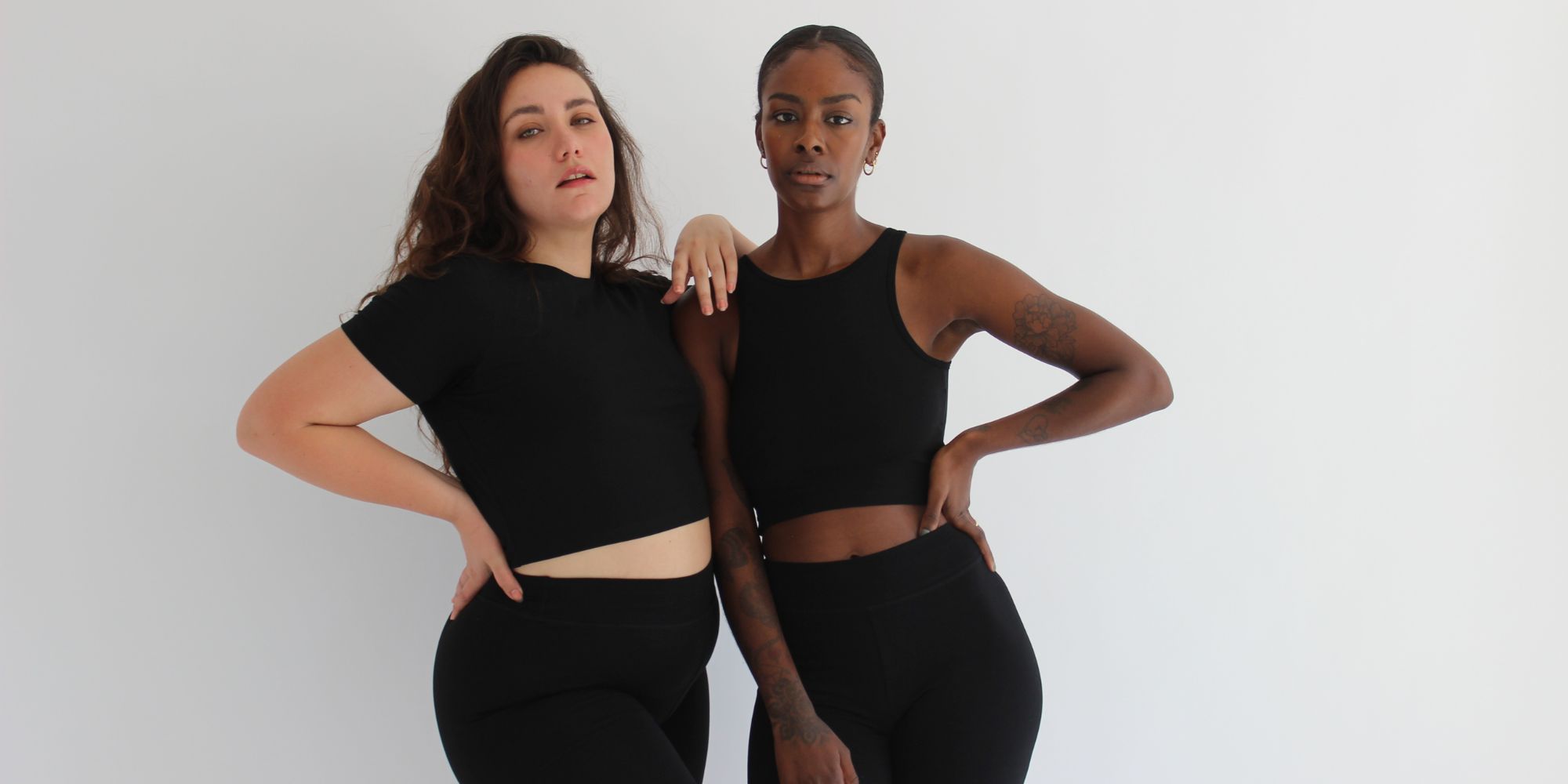 Two people modelling black elevated basics made responsibly by Pantee.