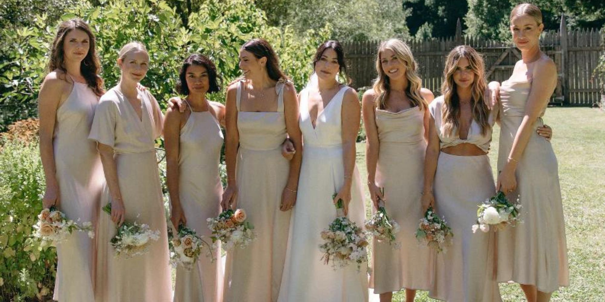Whimsy + Row founder Rachel and her bridesmaids looking happy in their custom Whimsy + Row more sustainable wedding clothes on the wedding day.