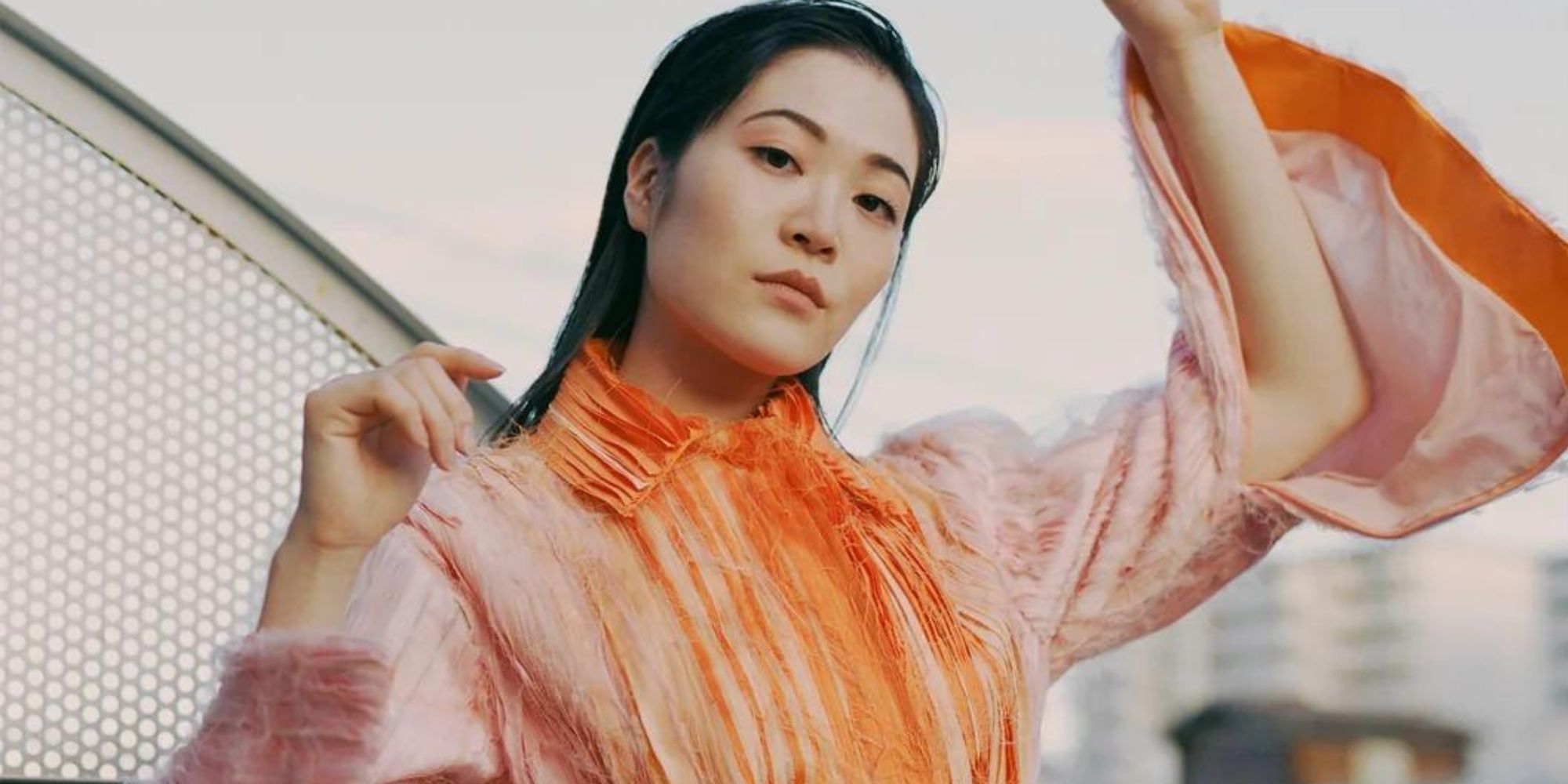 An upcycled orange kimono top by amaud.