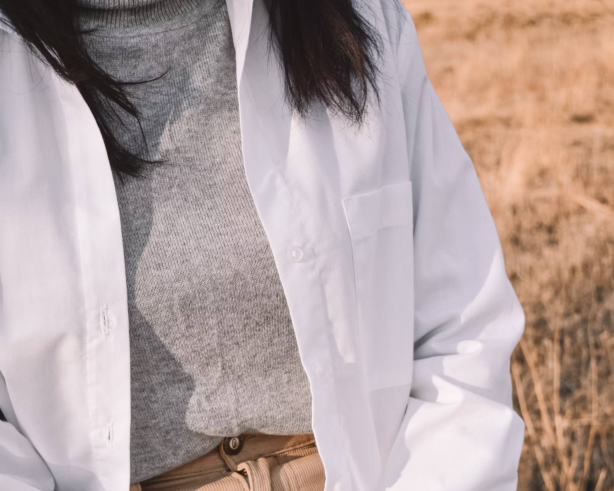 Person wearing sweater and shirt