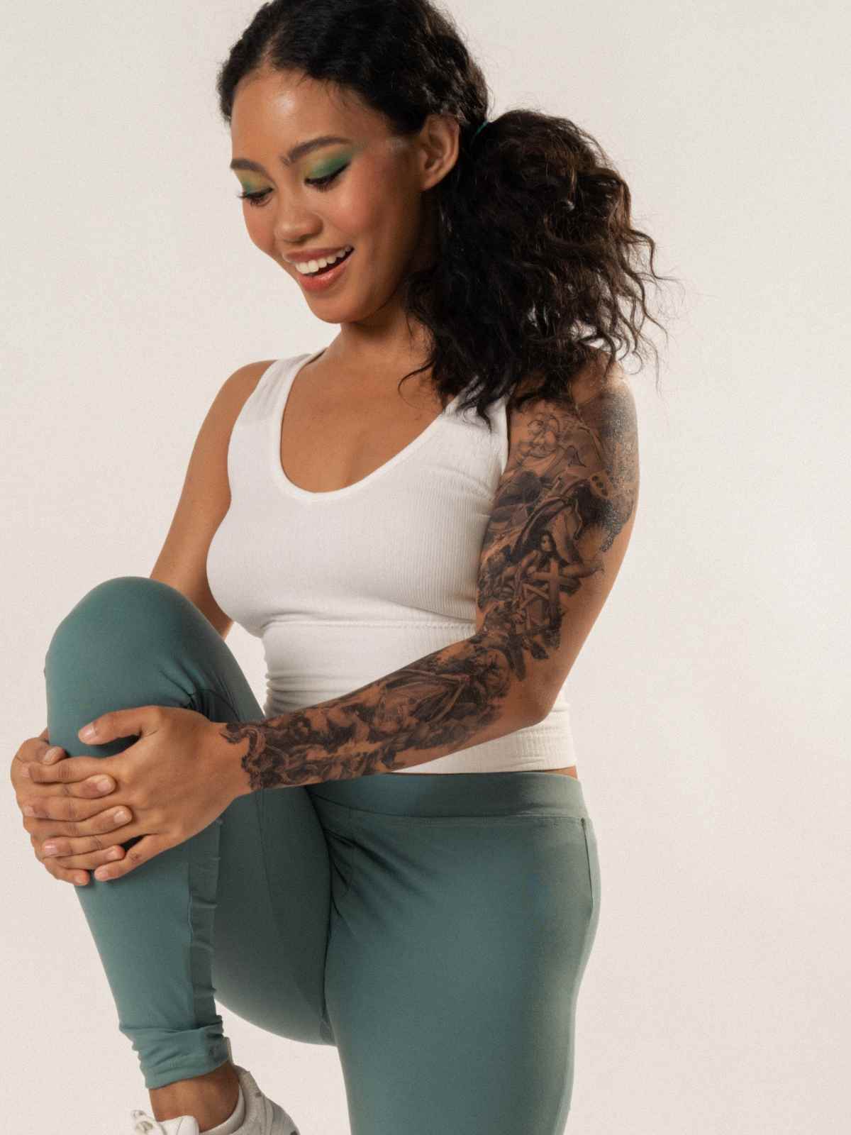 Person wearing green and white activewear