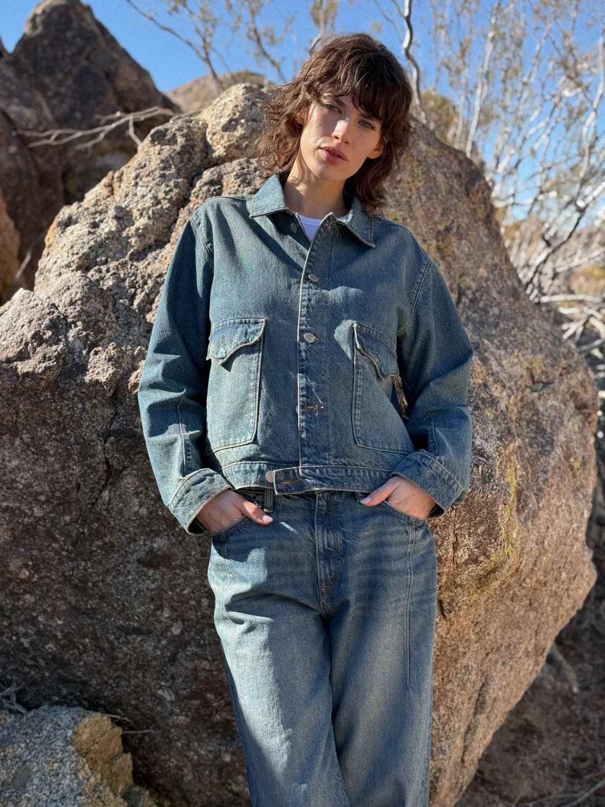 person wearing denim outfit from more sustainable denim brand triarchy