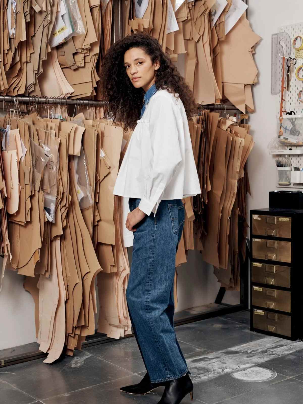 person in a pattern room wearing clothes from elv denim
