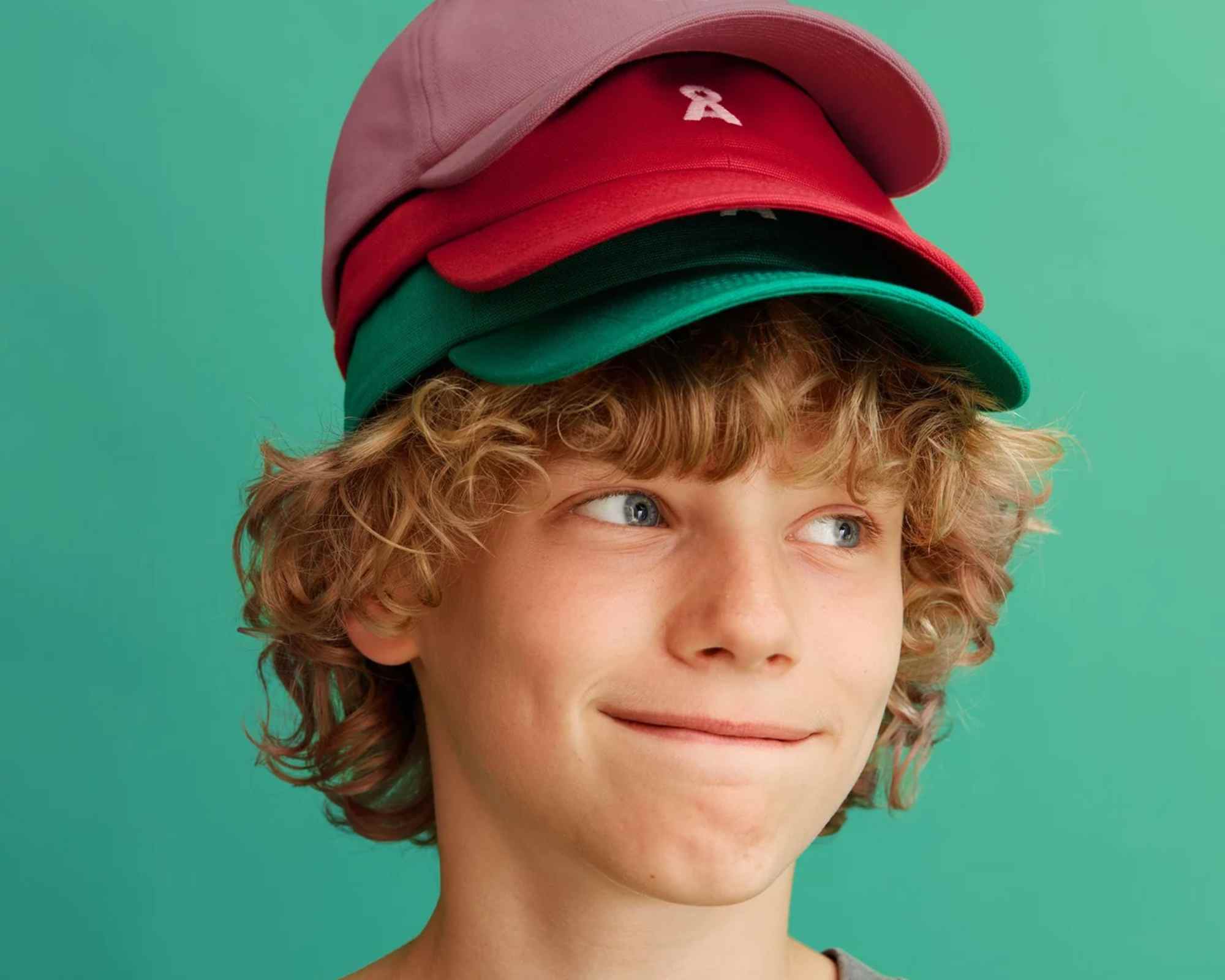 child wearing caps from armedangels